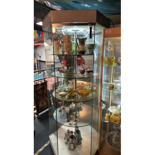 295 - Hexagonal display cabinet, four circular glass shelves, currently lit with an LED strip light, with ... 