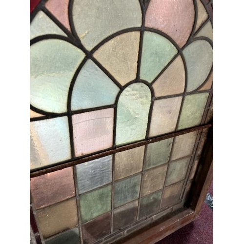 306 - A pair of framed stained glass windows, 77cm (h) x 57cm (w)  / All lots are located at Gower Reclama... 