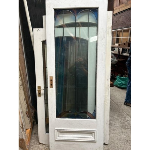 336 - Three doors with stained glass lead lined panels, largest panel 140cm (h) x 53cm (w)  / All lots are... 