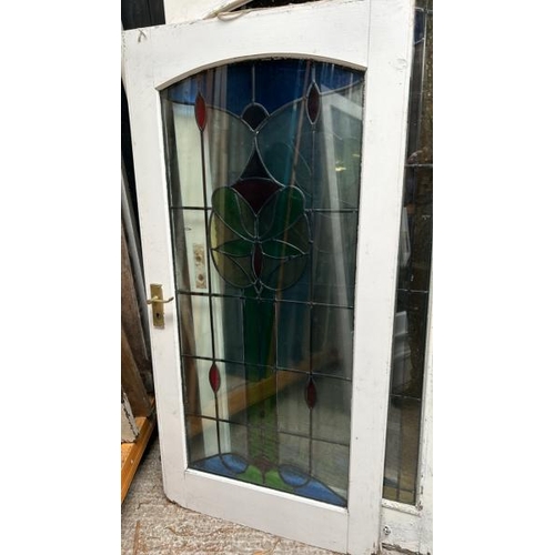 336 - Three doors with stained glass lead lined panels, largest panel 140cm (h) x 53cm (w)  / All lots are... 