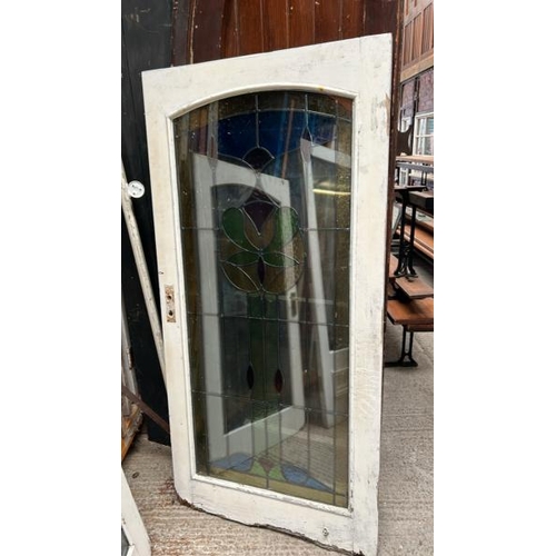 336 - Three doors with stained glass lead lined panels, largest panel 140cm (h) x 53cm (w)  / All lots are... 