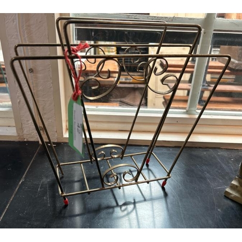 42 - A vintage brass magazine rack, one slightly damaged leg, 33cm (h) x 32cm (w)  / All lots are located... 