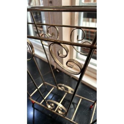 42 - A vintage brass magazine rack, one slightly damaged leg, 33cm (h) x 32cm (w)  / All lots are located... 