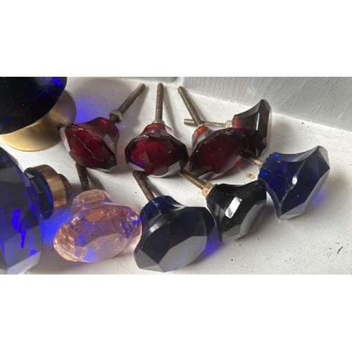 505 - Ten assorted blue and red glass draw handles and door handles  / All lots are located at Gower Recla... 