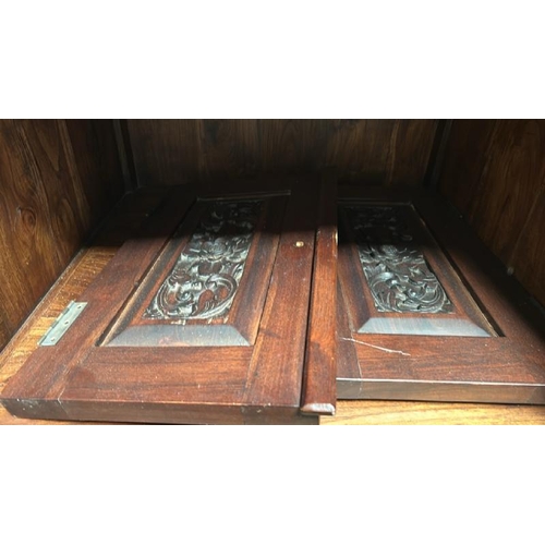 52 - An oak cupboard with carved panel doors and two compartments, 158cm (h) x 60cm (w) x 60cm (d)  / All... 