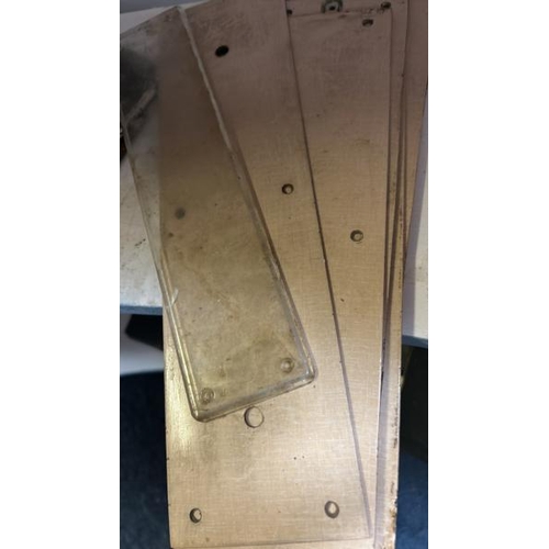 521 - Three vintage brass door pushplates with assorted wooden backplates  / All lots are located at Gower... 