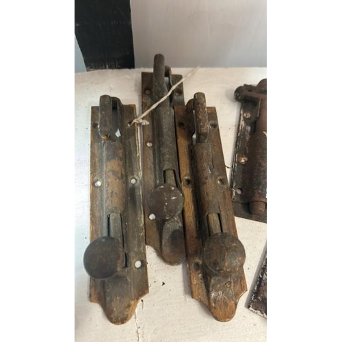 527 - Five assorted victorian bolt locks, largest 18cm long, with two brackets, door handle and two window... 