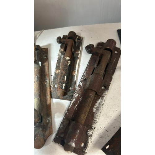 527 - Five assorted victorian bolt locks, largest 18cm long, with two brackets, door handle and two window... 