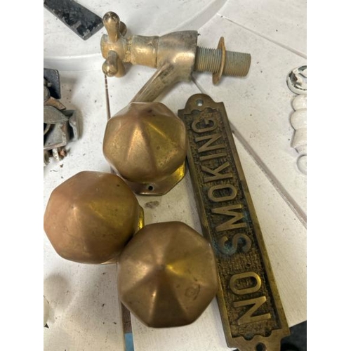 547 - Assorted brassware, including three door knobs, tap and no smoking sign, 22cm long  / All lots are l... 