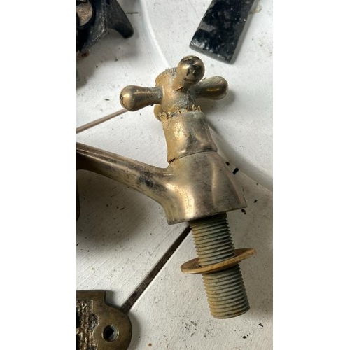 547 - Assorted brassware, including three door knobs, tap and no smoking sign, 22cm long  / All lots are l... 