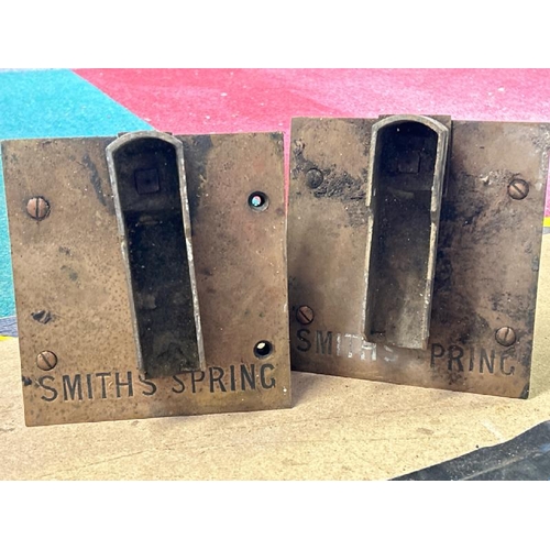 560 - Two brass smith spring clock parts, each 18x19cm  / All lots are located at Gower Reclamation, Unit ... 