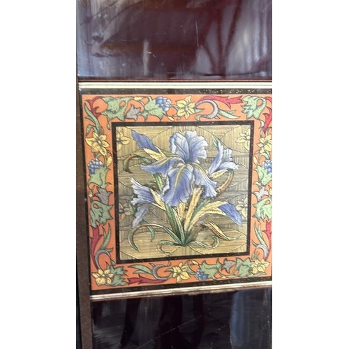 567 - Half set of three blue iris fireplace tiles, each 14cm squared, with metal tile holder  / All lots a... 