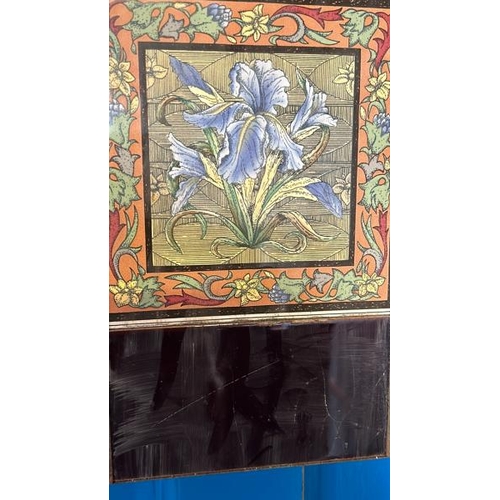 567 - Half set of three blue iris fireplace tiles, each 14cm squared, with metal tile holder  / All lots a... 