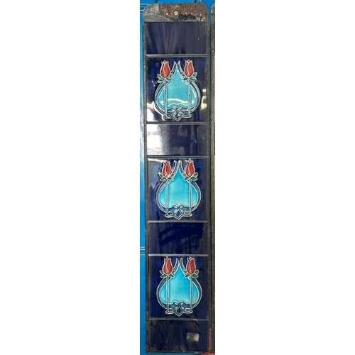 569 - Half set of art nouveau blue fireplace tiles, each 14x15.5cm, with metal tile holder  / All lots are... 