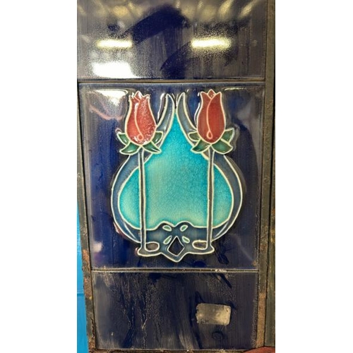 569 - Half set of art nouveau blue fireplace tiles, each 14x15.5cm, with metal tile holder  / All lots are... 