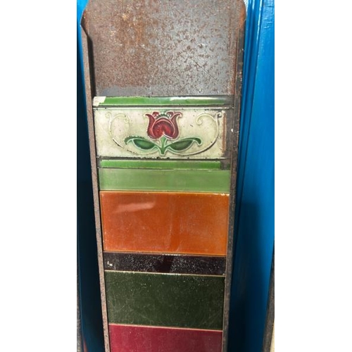 578 - Part set of colourful fireplace tiles of different sizes, with metal tile holder   / All lots are lo... 