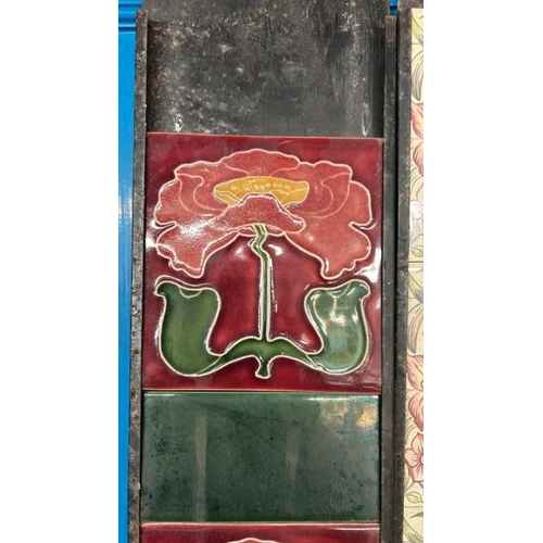 588 - Half set of art nouveau poppy fireplace tiles, each 15x15cm, with metal tile holder  / All lots are ... 