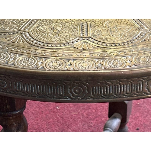 603 - Folding brass topped table, decorated with spider, snake, beetle and sea serpent, 60cm (dia), 57.5cm... 