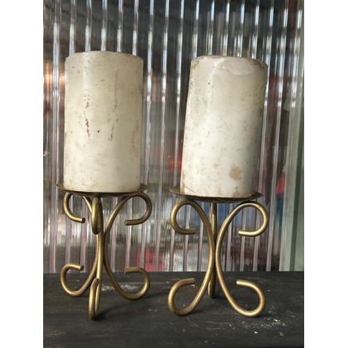 605 - Pair of brass based candle holders including candles, 12cm (h), without candle  / All lots are locat... 