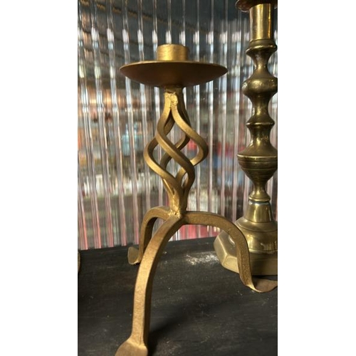 607 - Three brass candle holders including two of twisted form, tallest 28cm (h)  / All lots are located a... 