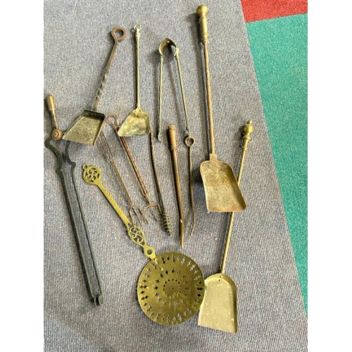 619 - Collection of vintage brass and metal fire tools including shovels, tongs and chestnut warmer  / All... 