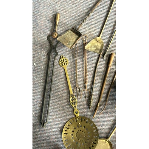 619 - Collection of vintage brass and metal fire tools including shovels, tongs and chestnut warmer  / All... 