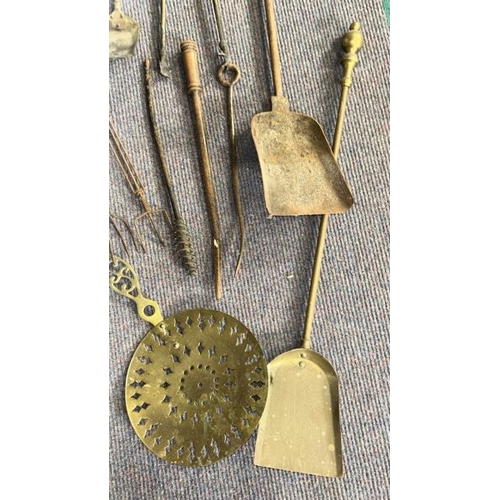 619 - Collection of vintage brass and metal fire tools including shovels, tongs and chestnut warmer  / All... 