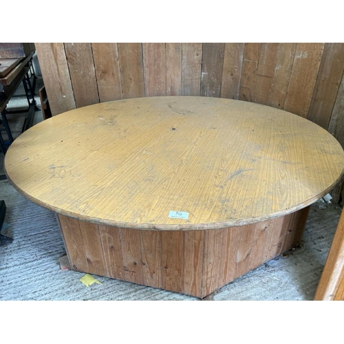 752 - A large circular wooden display plinth on octagonal base, 49cm (h) x 178cm (dia)  / All lots are loc... 