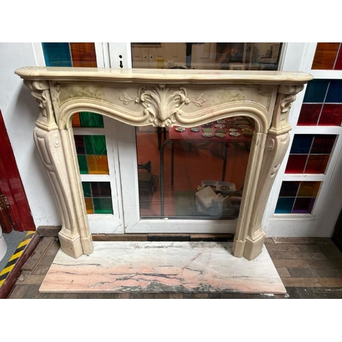 758 - A white marble resin copy fireplace surround, on authentic white marble base, profusely decorated wi... 