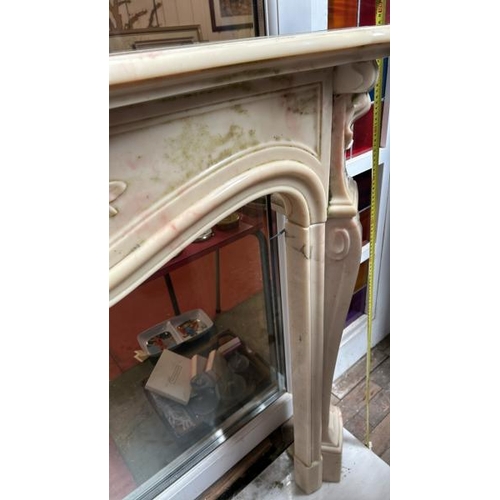 758 - A white marble resin copy fireplace surround, on authentic white marble base, profusely decorated wi... 