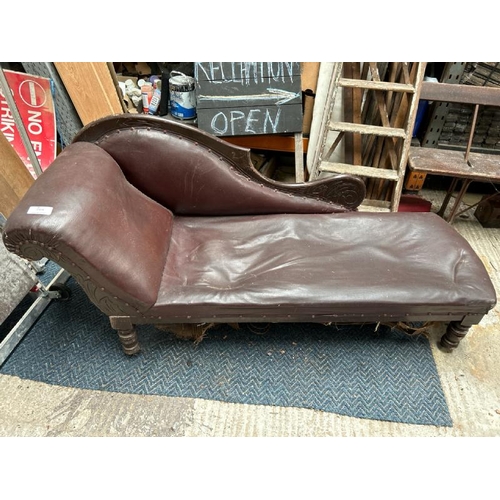 764 - Victorian chaise longue, with leather upholstery and carved wooden detail throughout, on turned and ... 