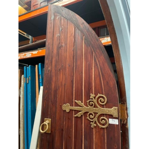 779 - A pair of ornate pitch pine church entry doors with original frame and hinges, included is the faux ... 