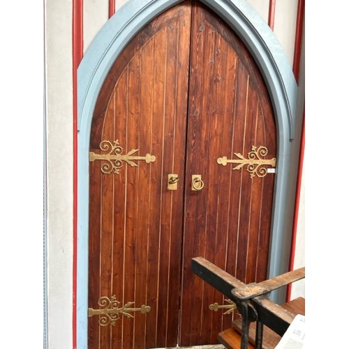 779 - A pair of ornate pitch pine church entry doors with original frame and hinges, included is the faux ... 