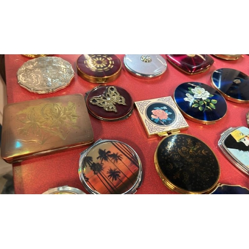 78 - A collection of thirty-eight assorted compacts, various styles  / All lots are located at Gower Recl... 