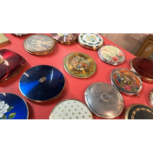 78 - A collection of thirty-eight assorted compacts, various styles  / All lots are located at Gower Recl... 