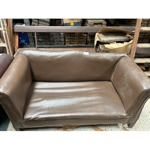 781 - A two seater faux leather sofa, 70cm (h) x 142cm (w) x 70cm (d)  / All lots are located at Gower Rec... 