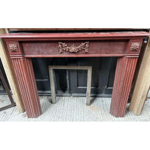 783 - A carved wooden fireplace surround, 108cm (h) x 136cm (w) x 15cm (d)  / All lots are located at Gowe... 