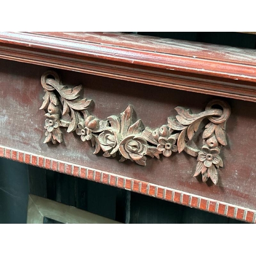 783 - A carved wooden fireplace surround, 108cm (h) x 136cm (w) x 15cm (d)  / All lots are located at Gowe... 