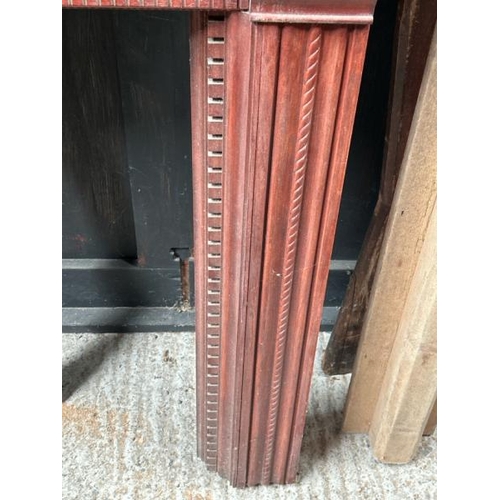 783 - A carved wooden fireplace surround, 108cm (h) x 136cm (w) x 15cm (d)  / All lots are located at Gowe... 