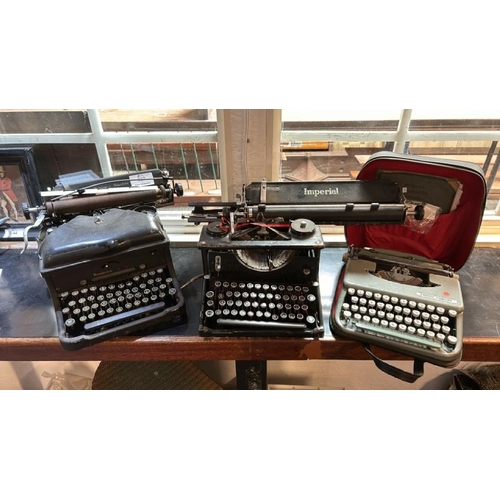 802 - Three typewriters through the ages, imperial circa 1930's,Remington Noiseless circa 1930's, Empire C... 