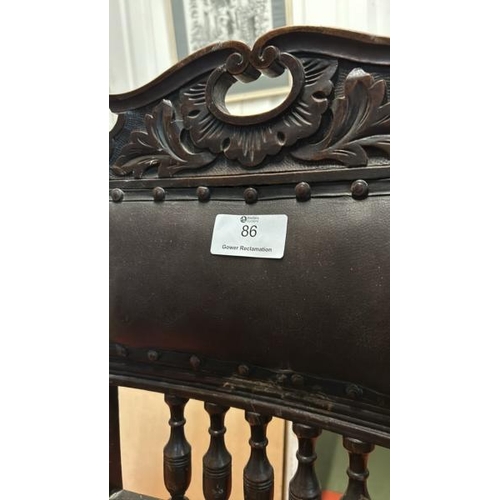 86 - A Victorian carved oak dining chair with upholstered seat and back, on two turned front legs, seat r... 