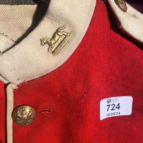 724 - 19th-century British military red tunic, featuring brass buttons and white cuffs   / All lots are lo... 