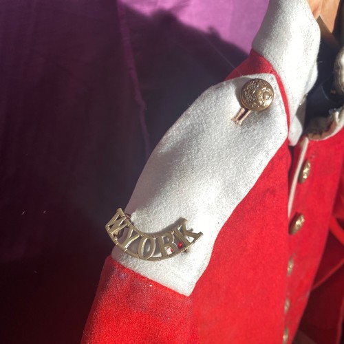 724 - 19th-century British military red tunic, featuring brass buttons and white cuffs   / All lots are lo... 