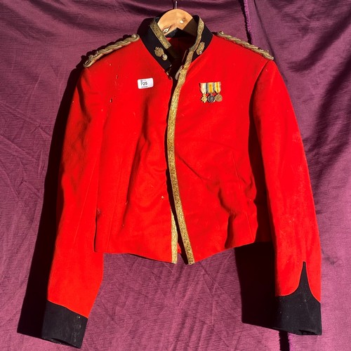 725 - British military red tunic from the early 20th century with three attached medals. It comes with det... 