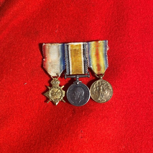 725 - British military red tunic from the early 20th century with three attached medals. It comes with det... 