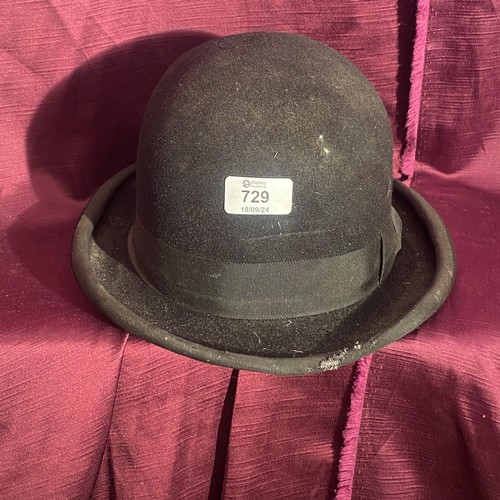 729 - Early 20th century vintage black bowler hat with ribbon trim and satin lining.    / All lots are loc... 