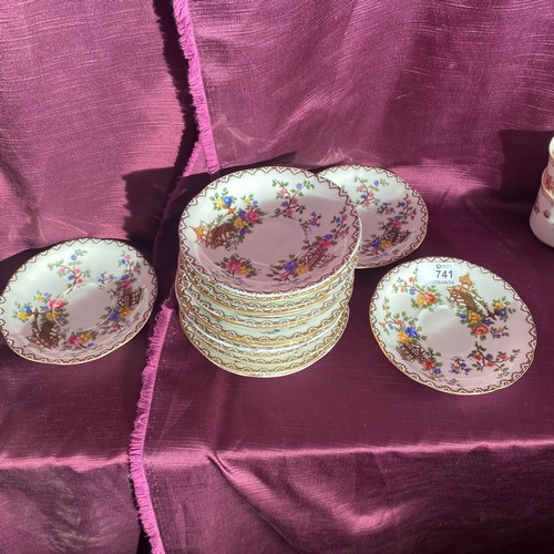 741 - Set of bone china dessert bowls. The bowls feature a floral pattern and are decorated with a gilt ed... 