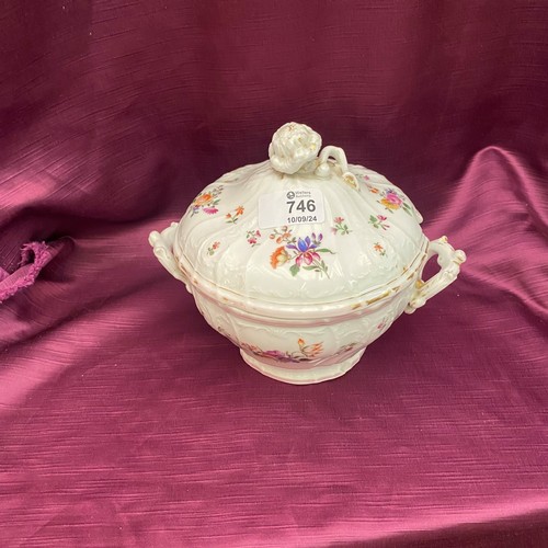 746 - This is an ornate porcelain tureen with a lid and a floral motif. It features intricate handles and ... 