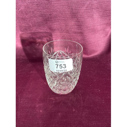 753 - A cut glass whiskey tumbler featuring an intricate diamond and floral pattern.   / All lots are loca... 