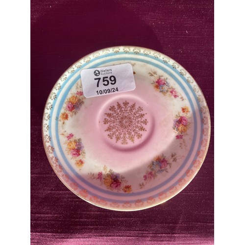 759 - Vintage bone porcelain saucer featuring floral motifs and gold accents. The design includes pink and... 